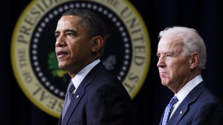 U.S. President Barack Obama (L) unveils a series of proposals to counter gun violence as Vice President Joe Biden looks on during an event at the White House in Washington, January 16, 2013. Vice President Joe Biden delivered his recommendations to Obama after holding a series of meetings with representatives from the weapons and entertainment industries as requested by the president after the December 14 school shooting in Newtown, Connecticut, in which 20 children and six adults were killed.  REUTERS/Jaso