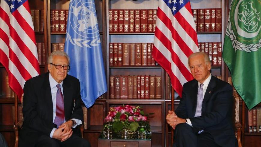 U.N. envoy Lakhdar Brahimi and U.S. Vice-President Joe Biden (R) meet for bilateral talks during the 49th Conference on Security Policy in Munich February 2, 2013. Senior U.S., Russian and U.N. officials, along with the leader of the Syrian opposition, were all expected in Munich on Saturday, providing a rare opportunity for talks to revive efforts to end the civil war in Syria.       REUTERS/Michael Dalder(GERMANY - Tags: MILITARY POLITICS) - RTR3D9H3