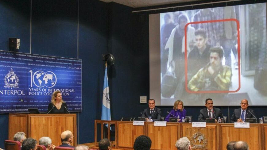 Interpol Secretary General Ronald Noble (2ndR) speaks during a news conference at the Interpol headquarters in Lyon, March 11, 2014. The head of international police agency Interpol said on Tuesday he did not believe the disappearance of a Malaysia Airlines plane at the weekend was a terrorist incident, suggesting two men who boarded using stolen passports may have been smuggled by traffickers. The plane carrying 239 people on board has now been missing for four days, with a search involving crews from 10 n