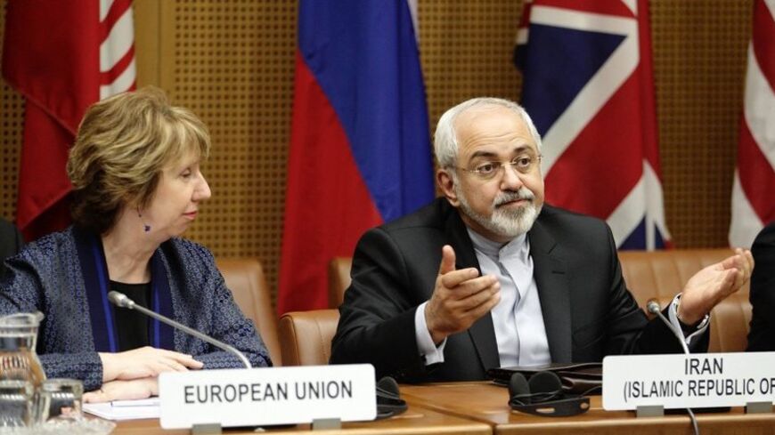 European Union Foreign Policy Chief Catherine Ashton (L) and Iranian Foreign Minister Mohammad Javad Zarif wait for the begin of talks in Vienna June 17, 2014. Six world powers and Iran began their fifth round of nuclear negotiations on Tuesday in hopes of salvaging prospects for a deal over Tehran's disputed atomic activity by a July deadline.  REUTERS/Heinz-Peter Bader (AUSTRIA - Tags: POLITICS ENERGY) - RTR3U83Y