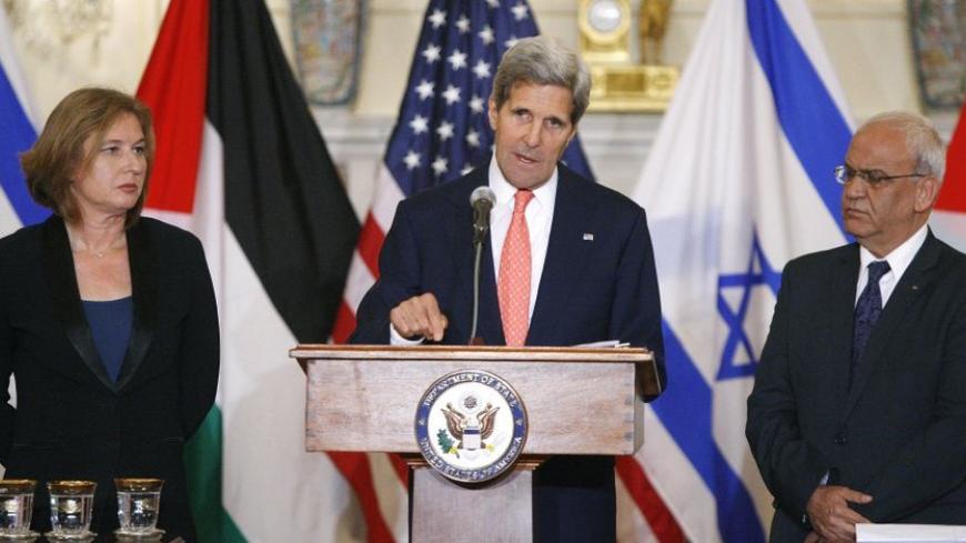 U.S. Secretary of State John Kerry announces further peace talks at a news conference with Israel's Justice Minister Tzipi Livni (L) and Chief Palestinian negotiator Saeb Erekat (R) at the State Department in Washington July 30, 2013. Israel and the Palestinians will seek to reach a peace agreement within nine months and negotiators will meet again within two weeks after holding a "positive" first round of talks, Kerry said on Tuesday. REUTERS/Jonathan Ernst (UNITED STATES - Tags: POLITICS) - RTX1250P