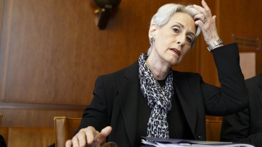 U.S. Under Secretary of State Wendy Sherman sits after arriving for a trilateral meeting with UN-Arab League envoy for Syria Lakhdar Brahimi and Russia's Deputy Minister of Foreign Affairs Gennady Gatilov during the second round of negotiations between the Syrian government and the opposition at the European headquarters of the United Nations, in Geneva, Switzerland, February 13, 2014. REUTERS/KEYSTONE/Valentin Flauraud/Pool (SWITZERLAND - Tags: POLITICS) - RTX18R7Y