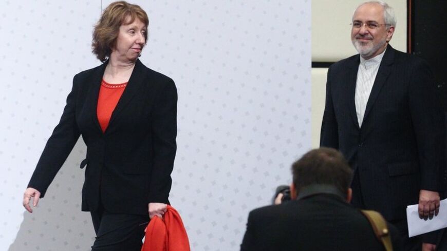 European Union foreign policy chief Catherine Ashton (L) and Iranian Foreign Minister Mohammad Javad Zarif arrive for a press statement after a conference in Vienna February 20, 2014. Iran and six world powers have agreed on an agenda for negotiations over Tehran's nuclear programme and will meet again in the second half of March in Vienna. REUTERS/Heinz-Peter Bader  (AUSTRIA - Tags: POLITICS ENERGY BUSINESS) - RTX195V5