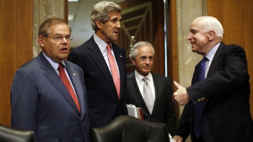 U.S. Secretary of State John Kerry (2nd L)  arrives to testify at a Senate Foreign Relations Committee hearing on national security and foreign policy priorities for the 2014 international affairs budget, on Capitol Hill in Washington, April 18, 2013. Kerry on Thursday asked senators pressing for tougher sanctions over Iran's nuclear ambitions to be patient, saying there is uncertainty in the Islamic republic two months before its June 14 election. Pictured with Kerry are (L-R) committee chairman Robert Men