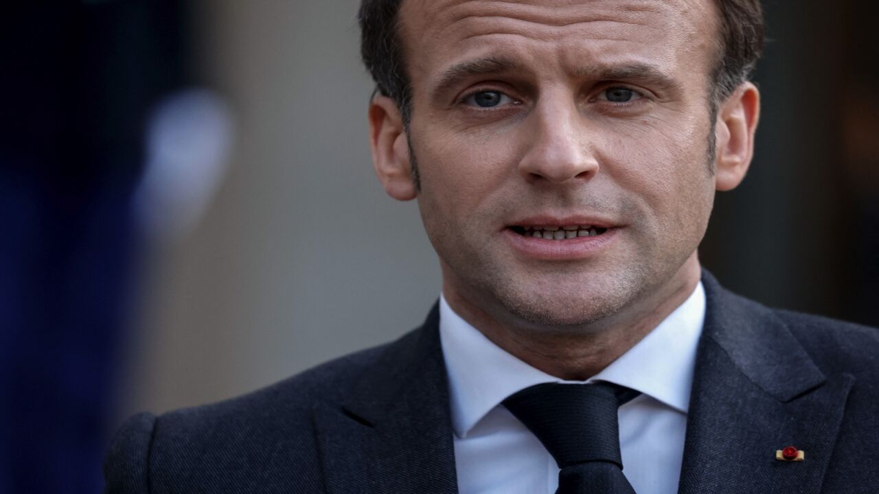 French President Emmanuel Macron talks to the press after a meeting with Libya's interim leaders at the Elysee Palace in Paris on March 23, 2021.