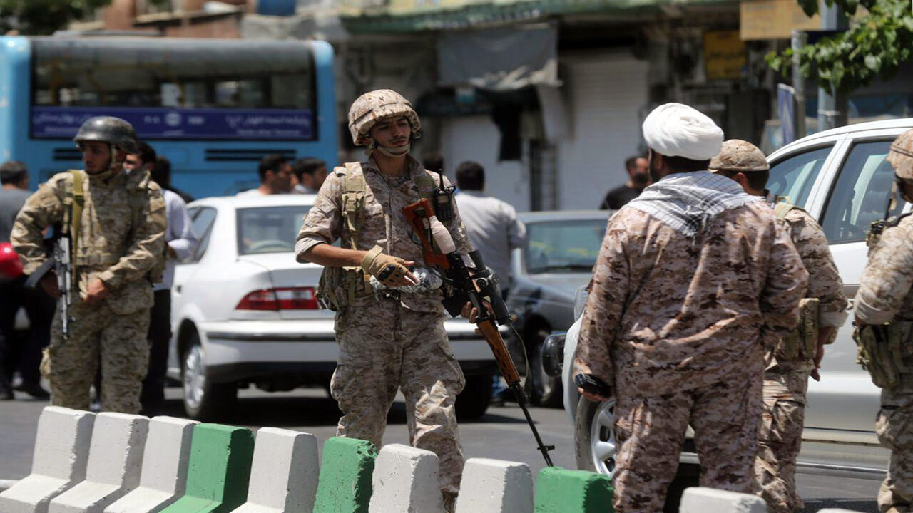 Members of the Islamic Revolutionary Guard Corps secure the area outside the Iranian parliament during an attack on the complex, Tehran, Iran, June 7, 2017.