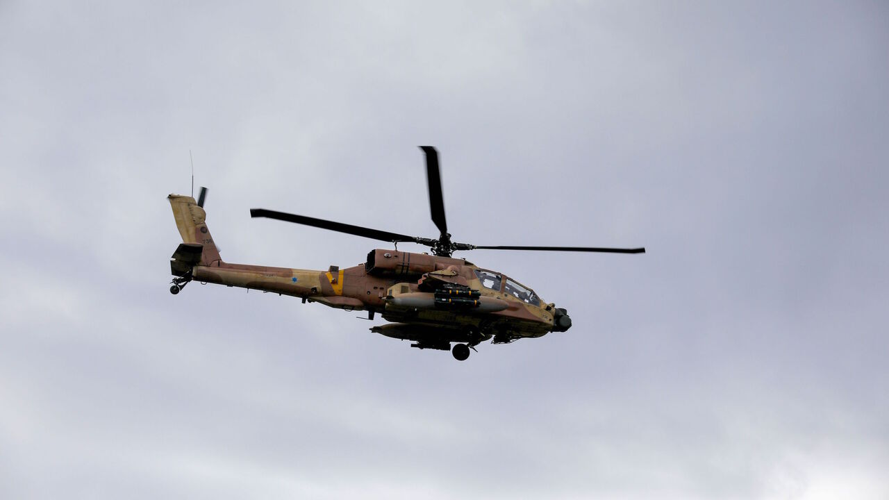 An Israeli army helicopter flies over the Israeli-annexed Golan Heights on Jan. 3, 2020. 