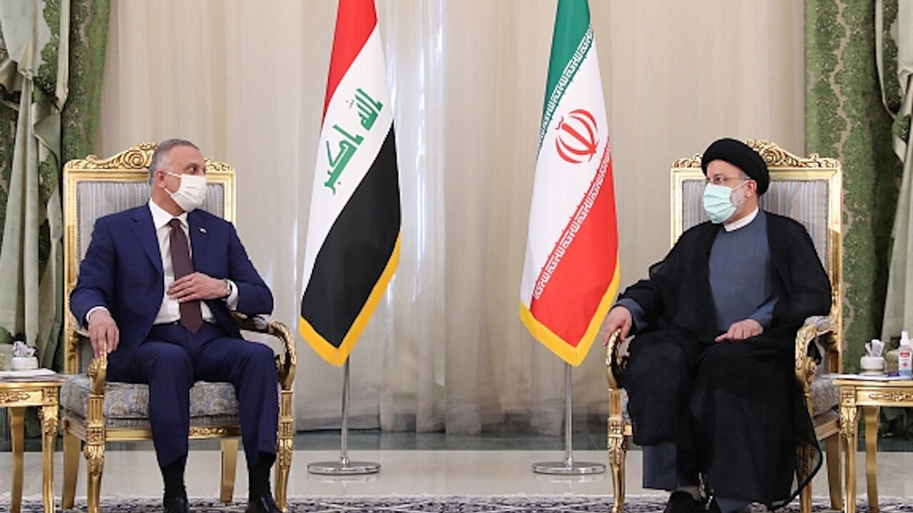 Iranian President Ebrahim Raisi (R) and Iraqi Prime Minister Mustafa al-Kadhimi (L) hold a joint press conference in Tehran, Iran, Sept. 12, 2021.
