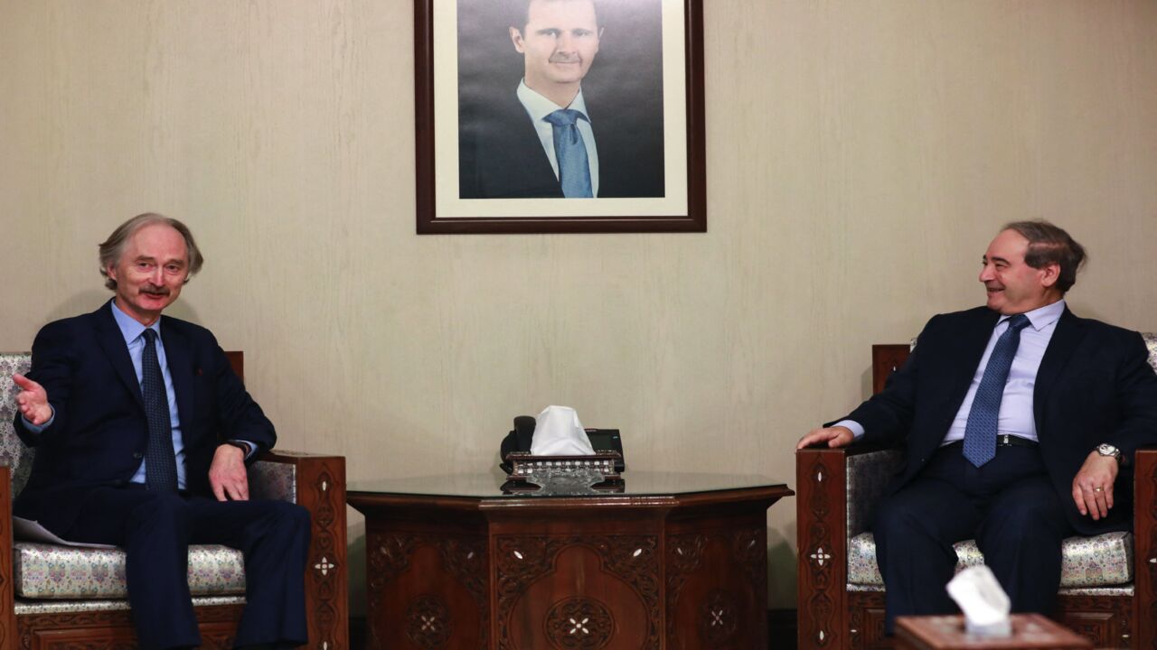 Syrian Foreign Minister Faisal Miqdad (R) receives the United Nations Special Envoy for Syria Geir Pedersen (L) in the capital Damascus, on Dec. 12, 2021.