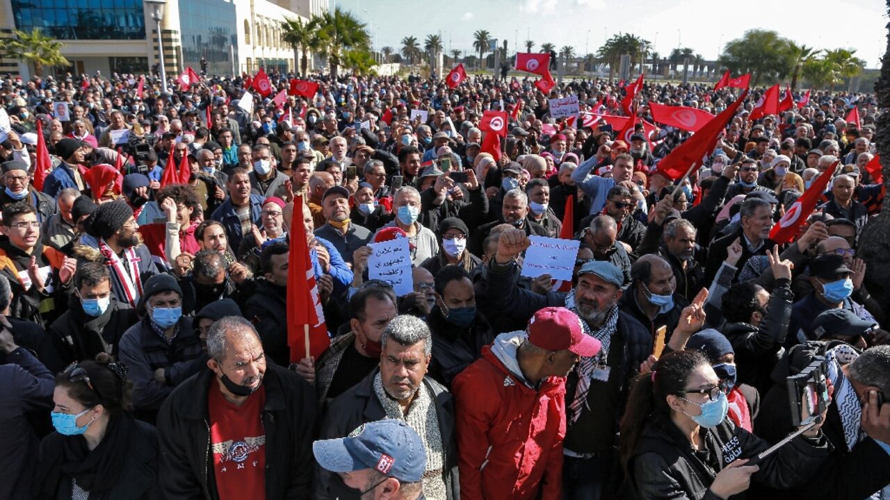 Tunisians protest against a power grab by President Kais Saied who on Sunday extended his control of the judiciary