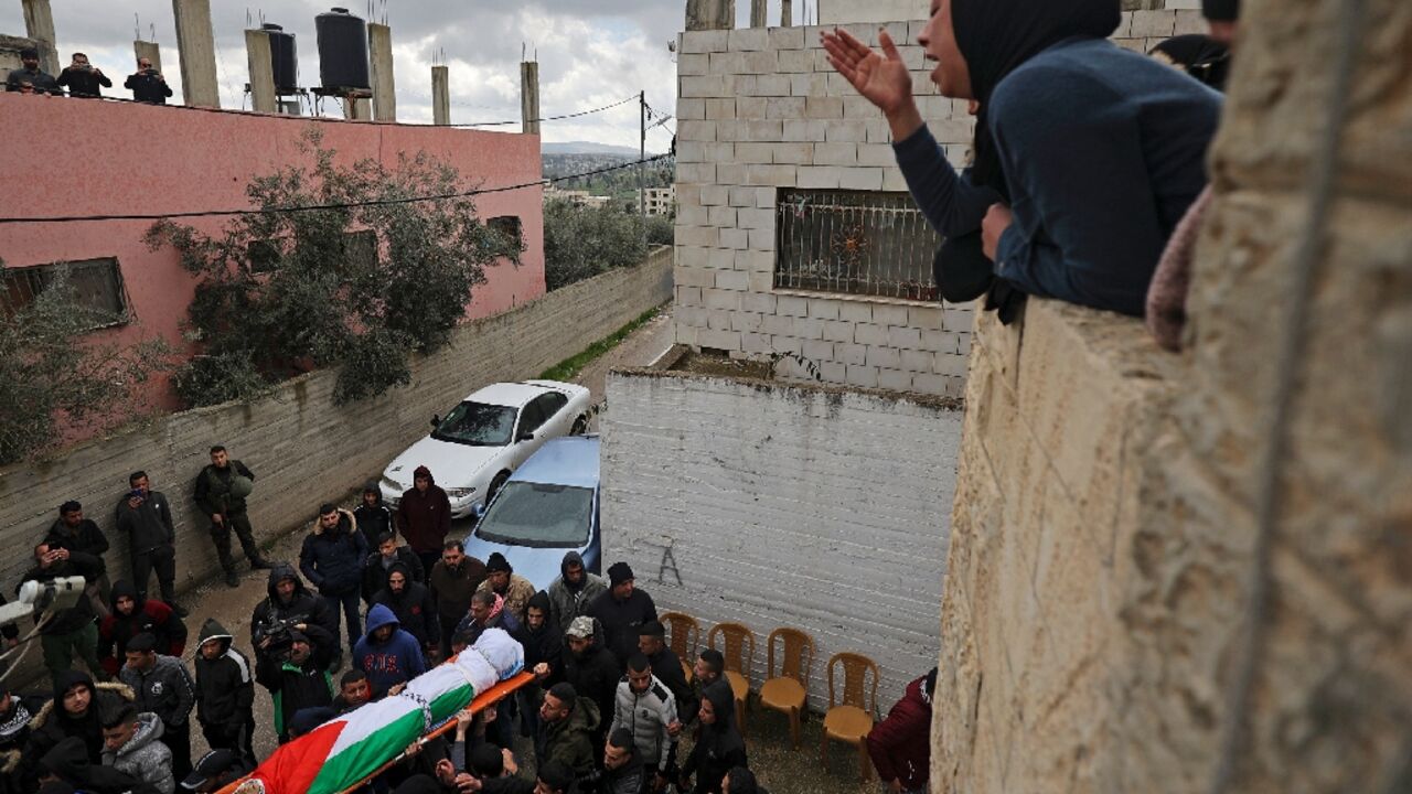 Mourners carry the body of 16-year-old Palestinian Nader Rayan who was killed by Israeli forces, during his funeral at the Balata camp near the northern city of Nablus