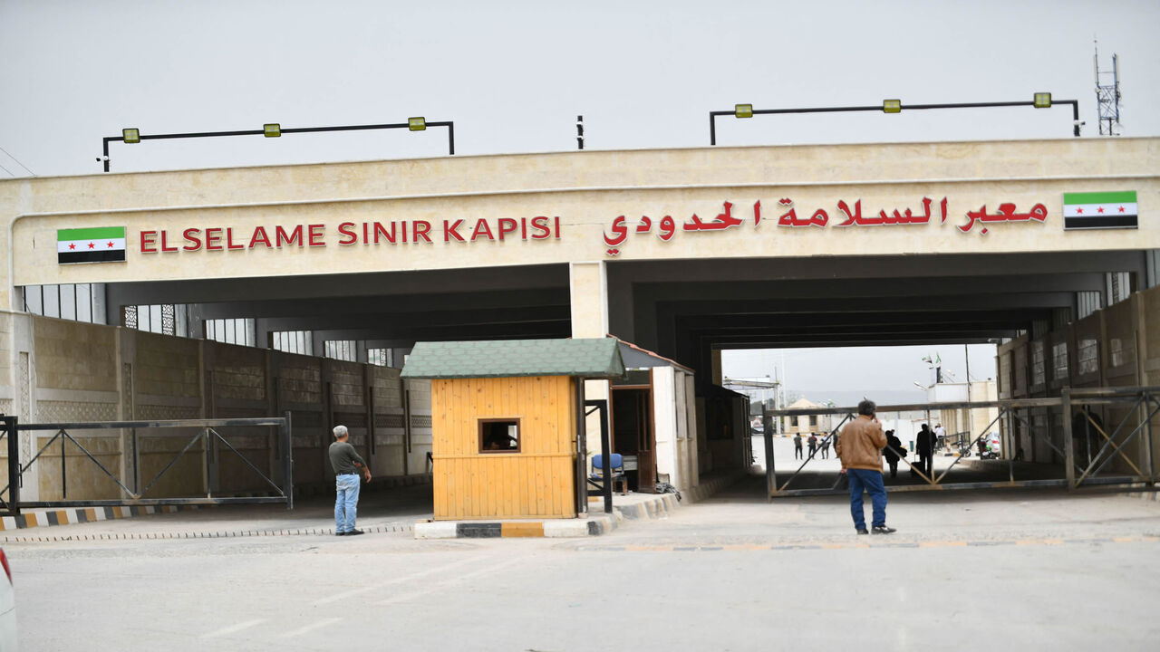Syrians coming from Turkey go through the Bab al-Salame crossing in the border town of Azaz in the rebel-held north of Aleppo province, to spend the last days of Ramadan and the Eid al-Fitr holiday early next month with family, Syria, April 18, 2022.