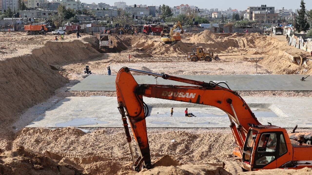 Egyptian diggers and earth movers work at the construction site of a new housing complex north of Gaza City. Egypt and Qatar have provided reconstruction aid to Gaza