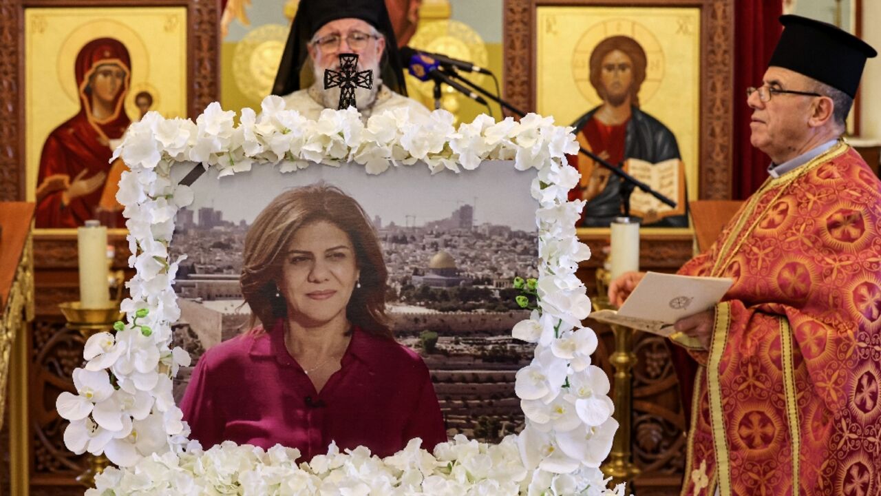 Archimandrite Abdullah Yulio, parish priest of the Melkite Greek Catholic church in Ramallah, speaks during the 40th day after death memorial service for the late Palestinian and veteran Al Jazeera journalist Shireen Abu Akleh 
