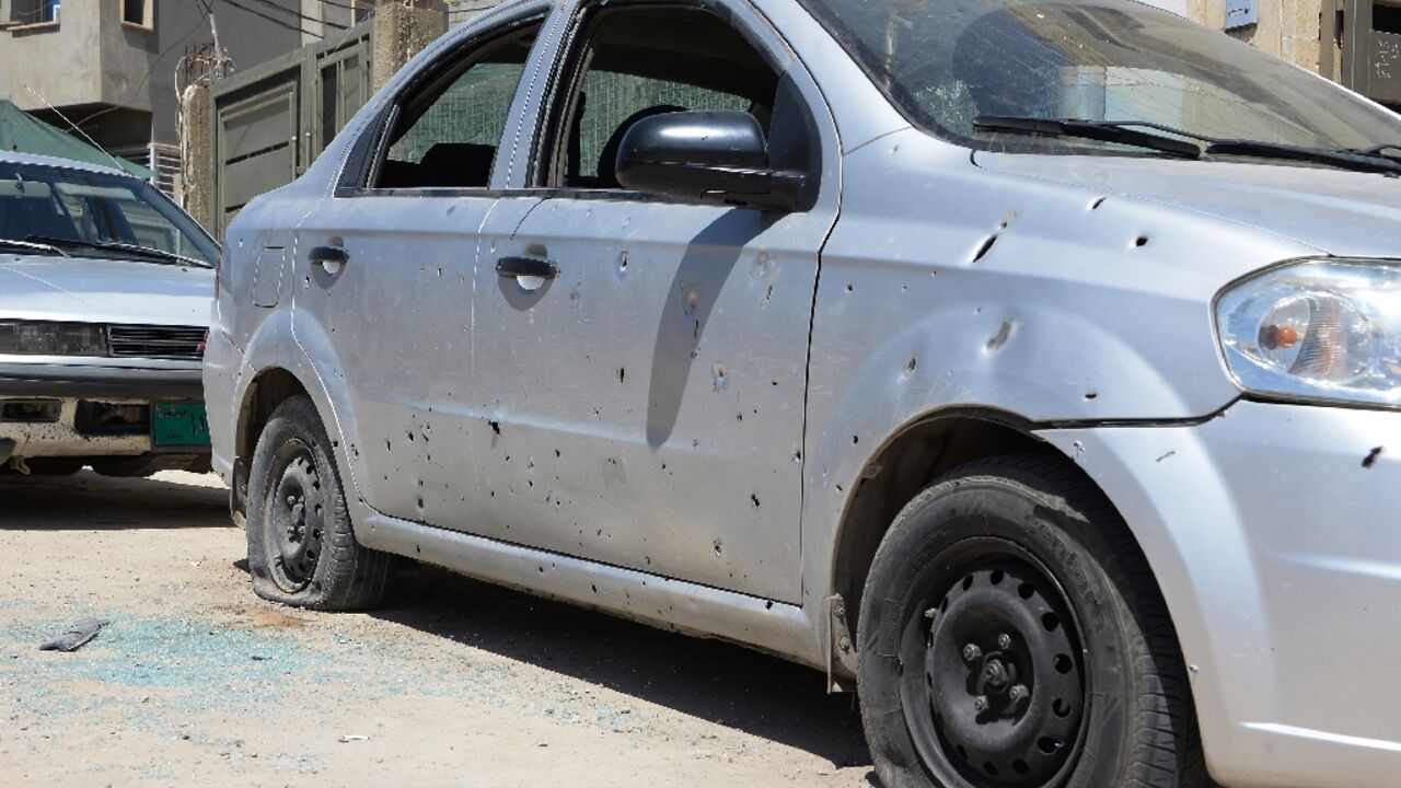 Cars parked outside the Turkish consulate in Iraq's main northern city of Mosul are peppered with shrapnel from the overnight rocket fire