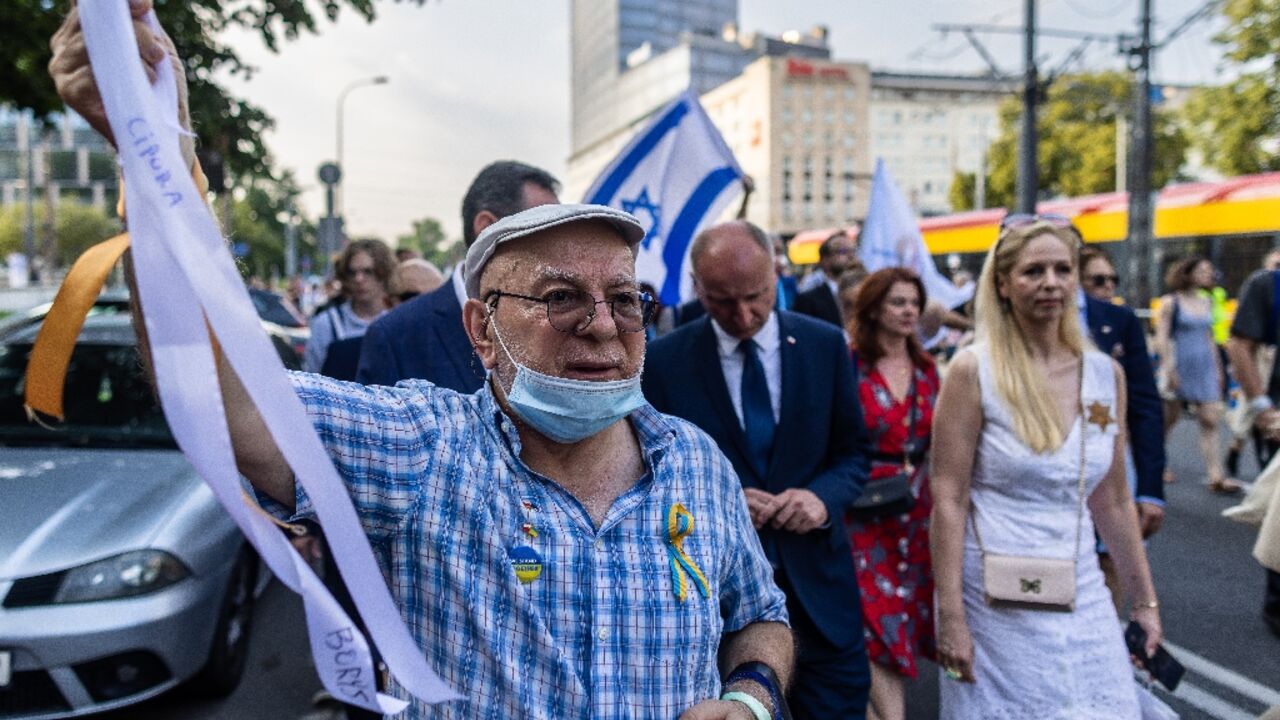 The procession passed through the location where Jews were deported from the ghetto to the Treblinka extermination camp