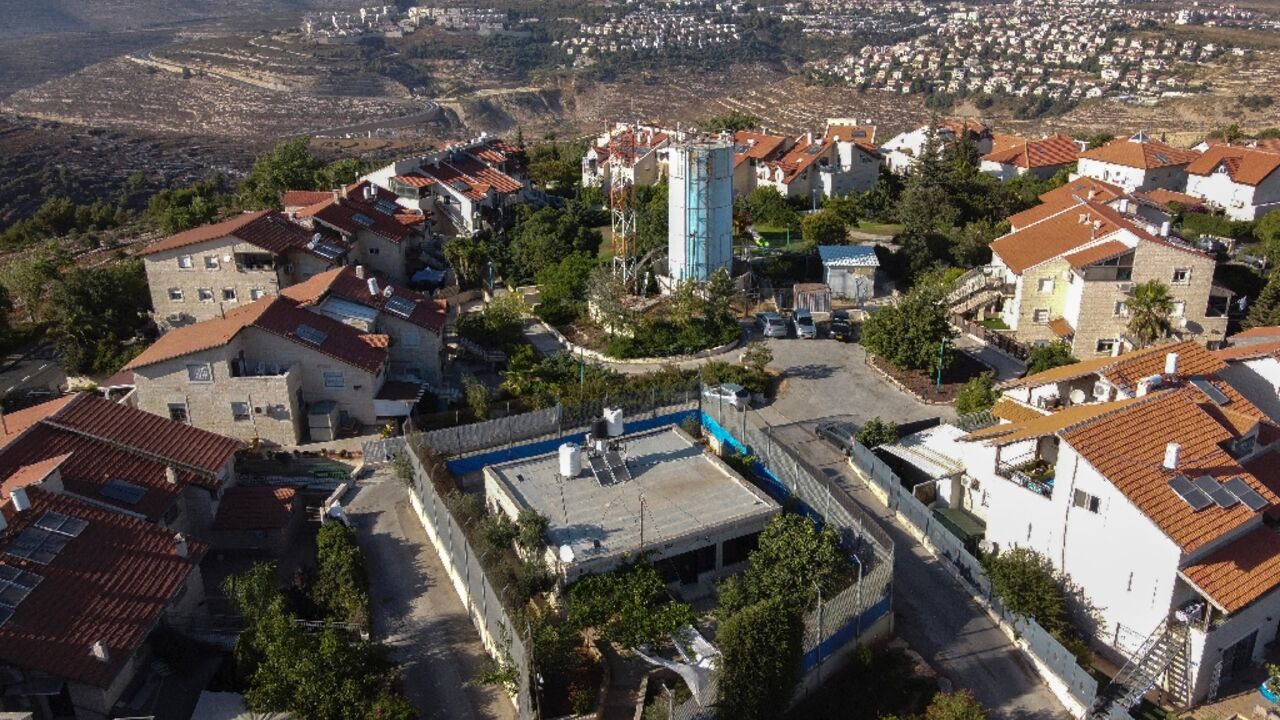 For years the Palestinian family home stood amid swathes of farmland, but now it lies behind a yellow gate controlled by Israeli soldiers