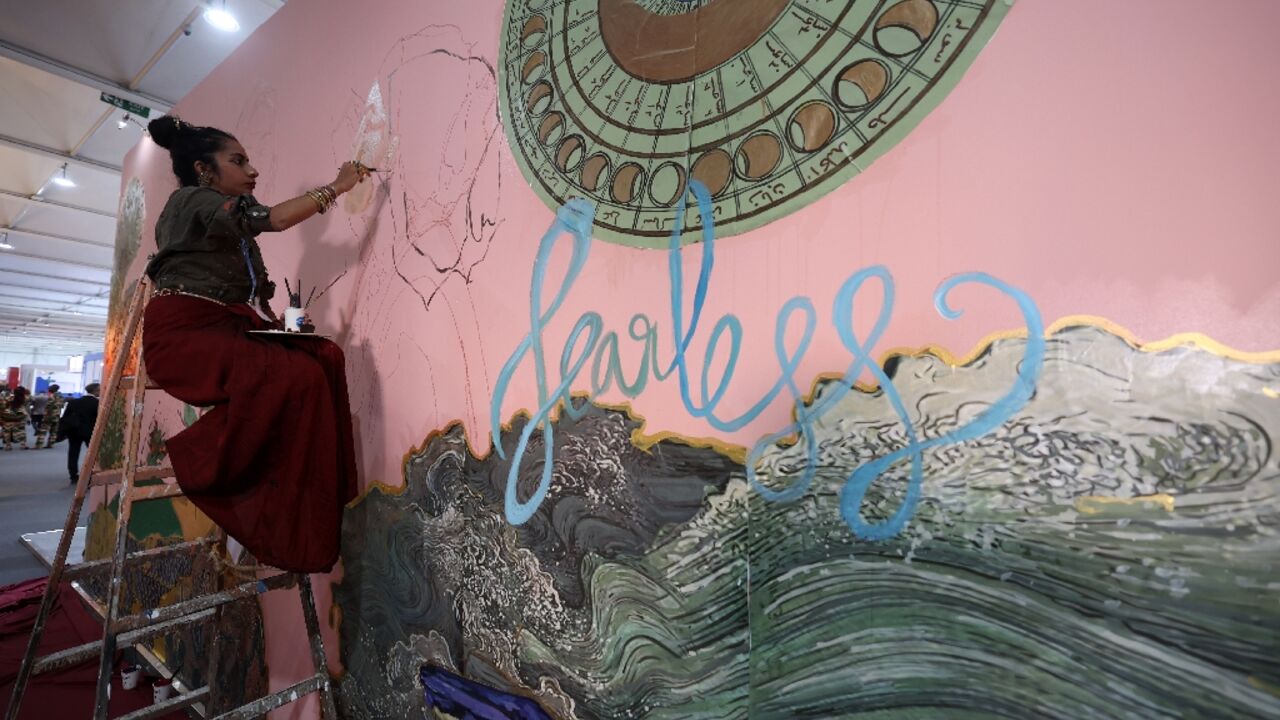 Award-winning Indian artist Shilo Shiv Suleman painted a mural called "fearless" at the youth pavillon, during the COP27 climate summit in the Red Sea resort of Sharm el-Sheikh