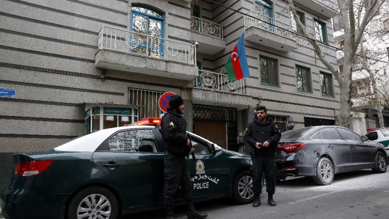 Police stand guard in front of the Azerbaijan embassy in Tehran  following Friday's attack