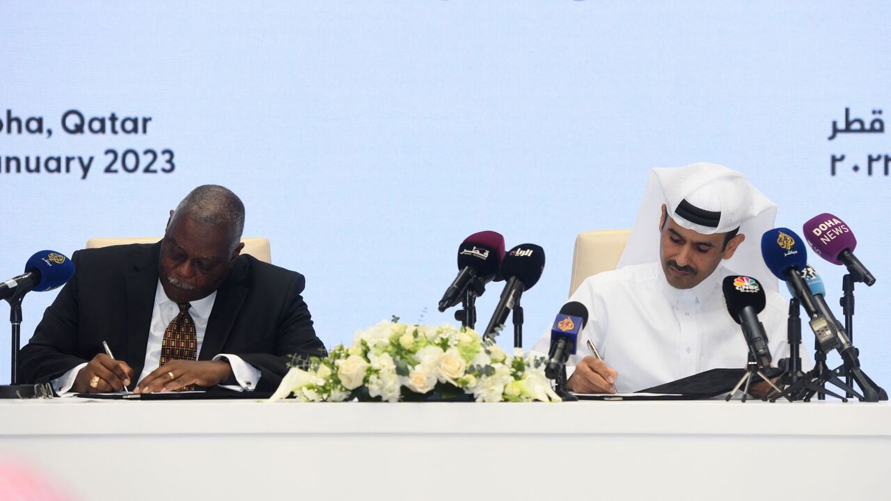 Saad Sherida al-Kaabi (R), Qatar's energy minister and CEO of QatarEnergy, and Bruce Chinn, CEO of Chevron Phillips Chemical company, attend a signing ceremony at the QatarEnergy headquarters in Qatar's capital Doha on January 8, 2023. (Photo by AMR DIAB/AFP via Getty Images)