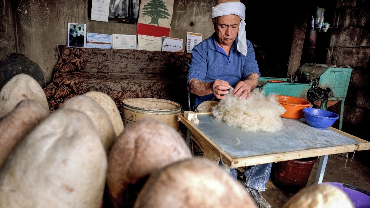 Hatmaker Youssef Akiki prepares to shape one of his traditional "labbadeh" caps with olive soap at his workshop in the mountain village of Hrajel 