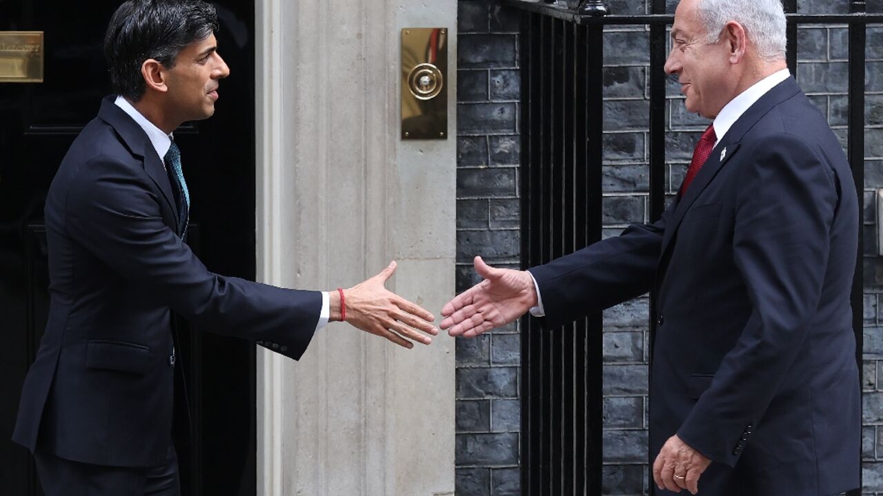 Demonstrators could be heard shouting 'shame' as Israel's Benjamin Netenyahu (R) met his UK counterpart, Prime Minister Rishi Sunak (L)