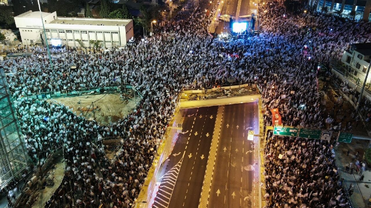 Many of the protesters in the coastal city of Tel Aviv were waving Israeli flags