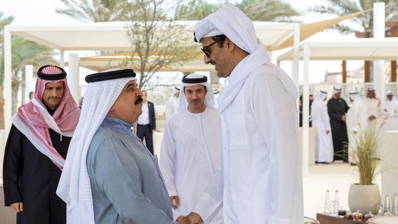 King of Bahrain Hamad bin Isa Al Khalifa greets Emir of Qatar Sheikh Tamim bin Hamad Al Thani in Abu Dhabi, Jan. 18, 2023.