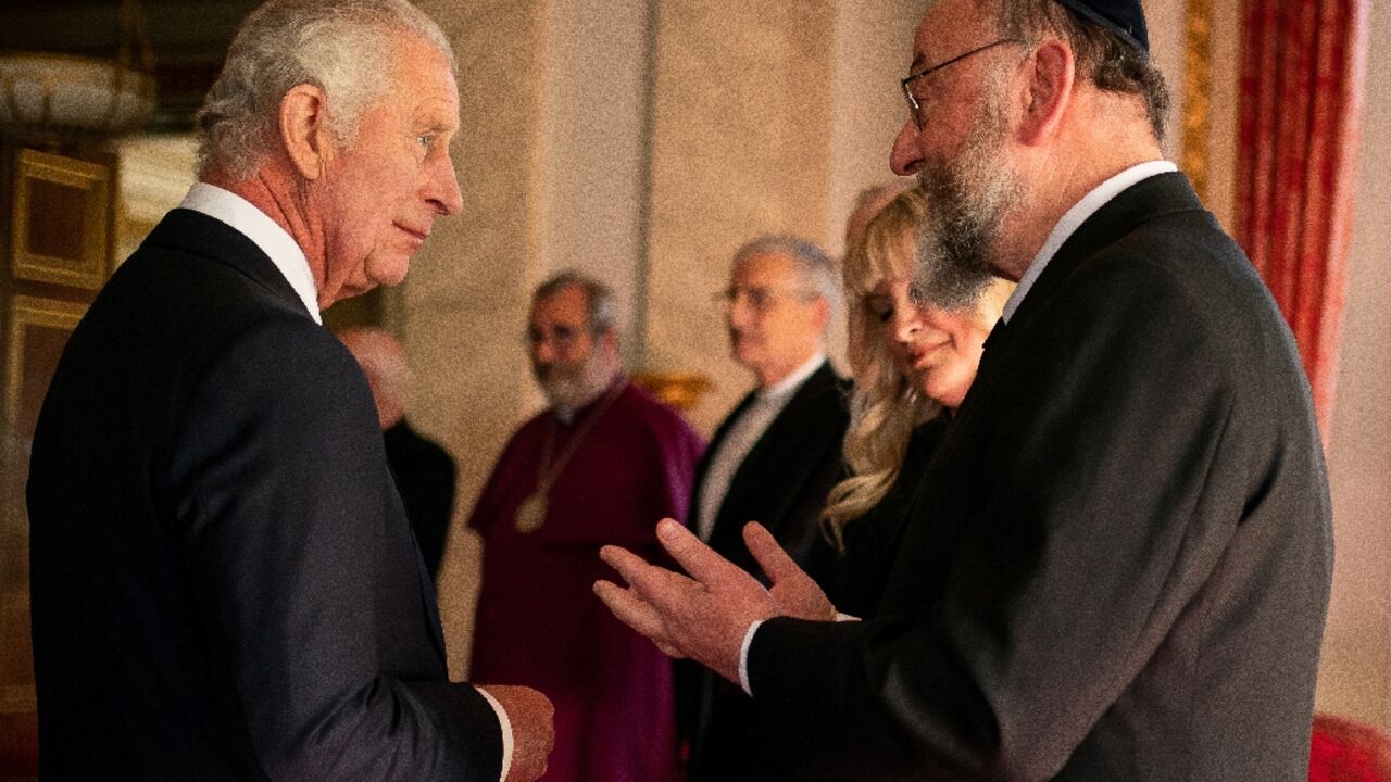 Britain's Chief Rabbi Ephraim Mirvis (R) praised King Charles III for allowing him to attend the coronation without breaking Shabbat rules