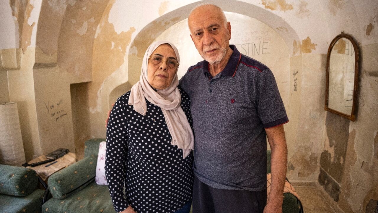 Palestinian couple Nora and Mustafa Sub Laban pose for a picture in their home in the walled Old City of Israeli-annexed east Jerusalem, which they are set to lose of Jewish settlers after a 45-year legal battle