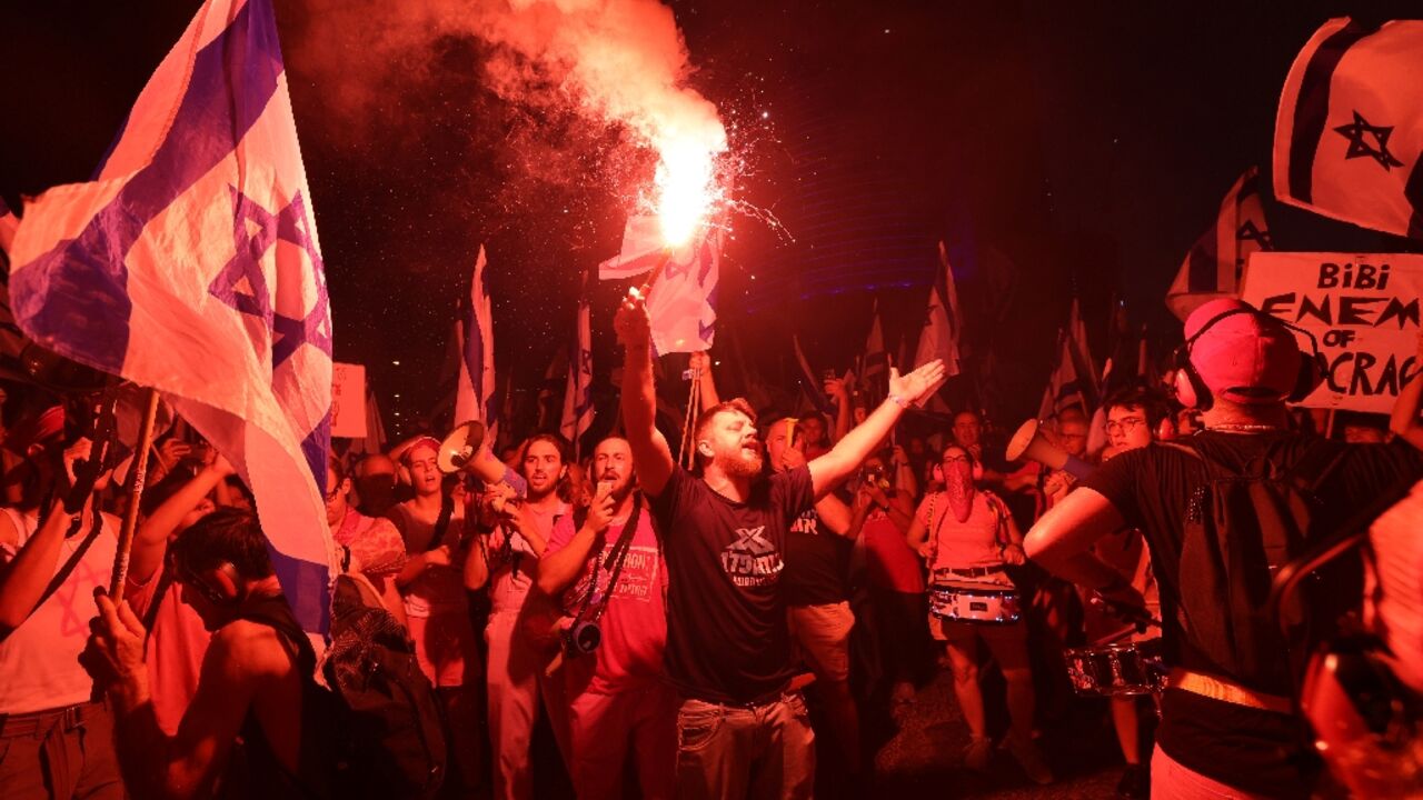 Demonstrators rally against the Israeli government in Tel Aviv to protest a judicial reform package they say threatens democracy
