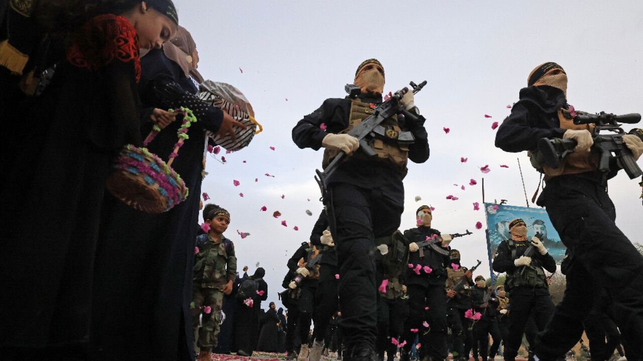 Palestinian militants of the Islamic Jihad movement participate in a military parade in Gaza City