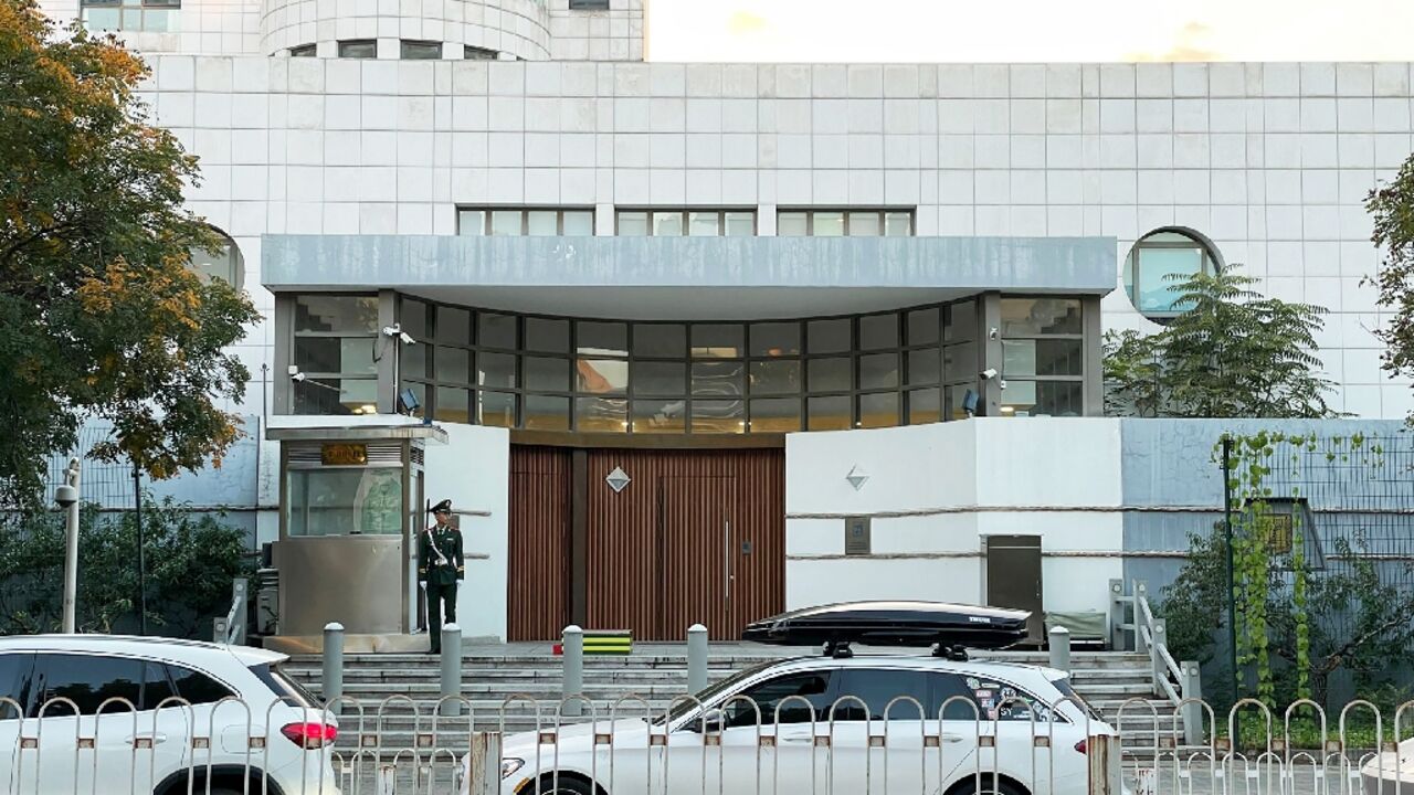 A Chinese policeman stands guard at the entrance to the Israeli embassy in Beijing after an embassy employee was attacked elsewhere in the city