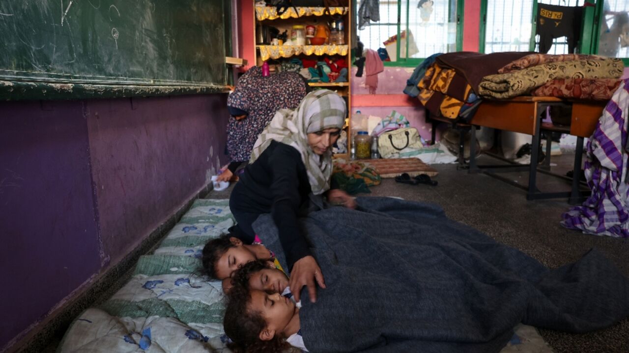 Palestinians sought refuge after Israel warned them to evacuate the northern Gaza Strip before an expected ground offensive against Hamas, one week after the deadliest attack in Israel's history