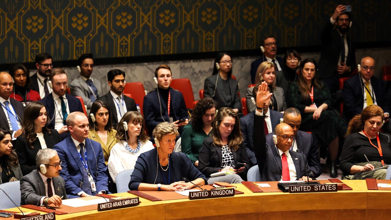 US Deputy Ambassador to the UN Robert Wood (2nd R) raises his hand during a United Nations Security Council after the vote about a ceasefire in Gaza at UN headquarters in New York on Dec. 8, 2023.
