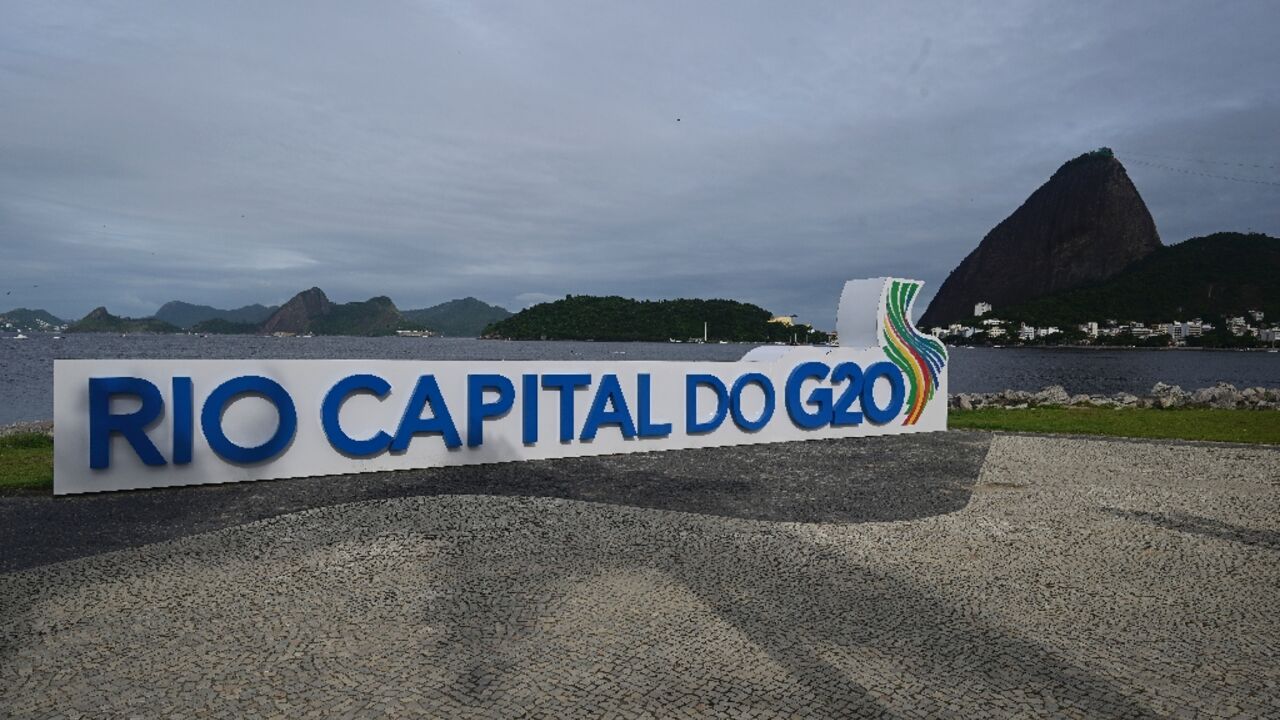 A G20 Brazil sign is seen in front of Rio de Janeiro's iconic Sugarloaf Mountain