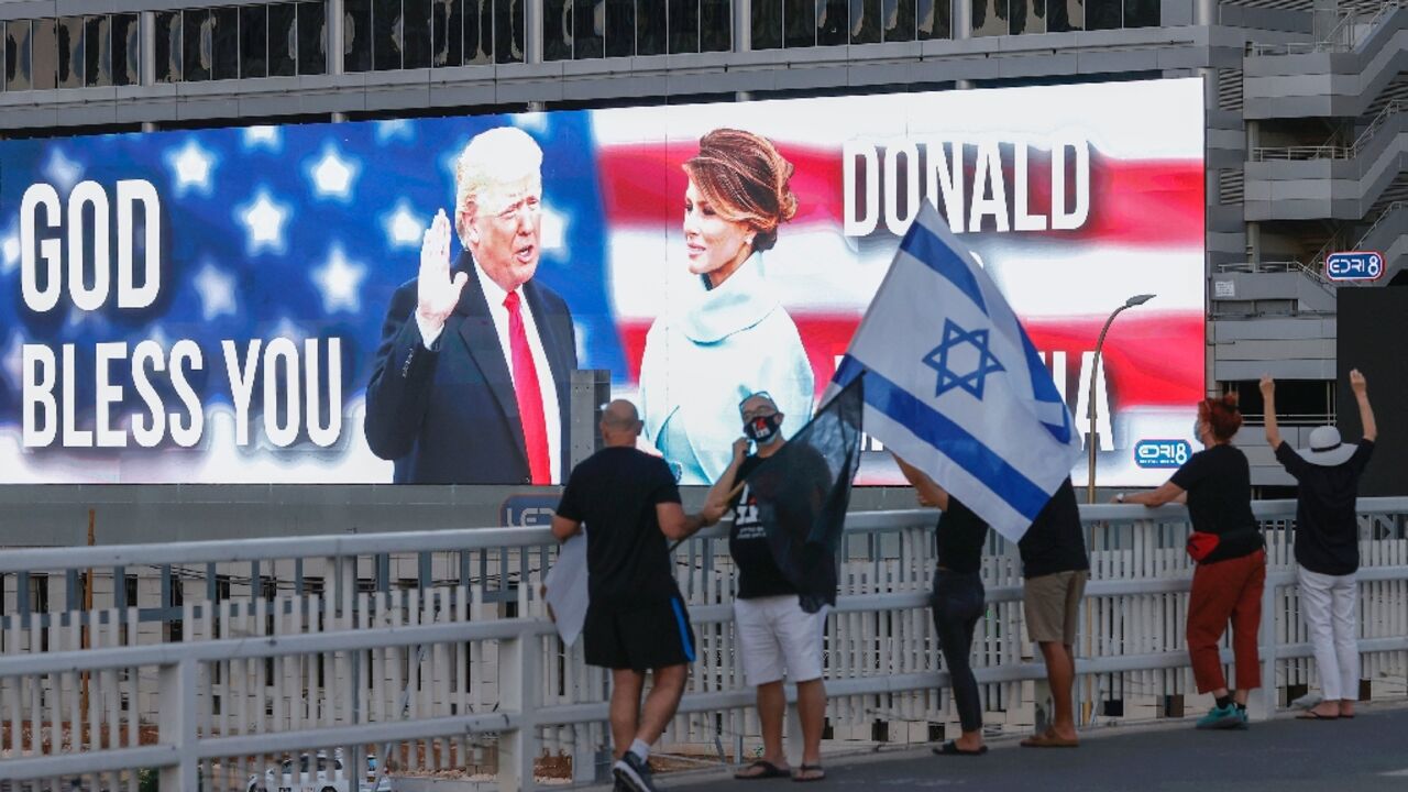 Then-US president Donald Trump and his wife Melania Trump are seen on a jumbo screen in Tel Aviv, Israel -- but lately, his level of support for Israel has been vague