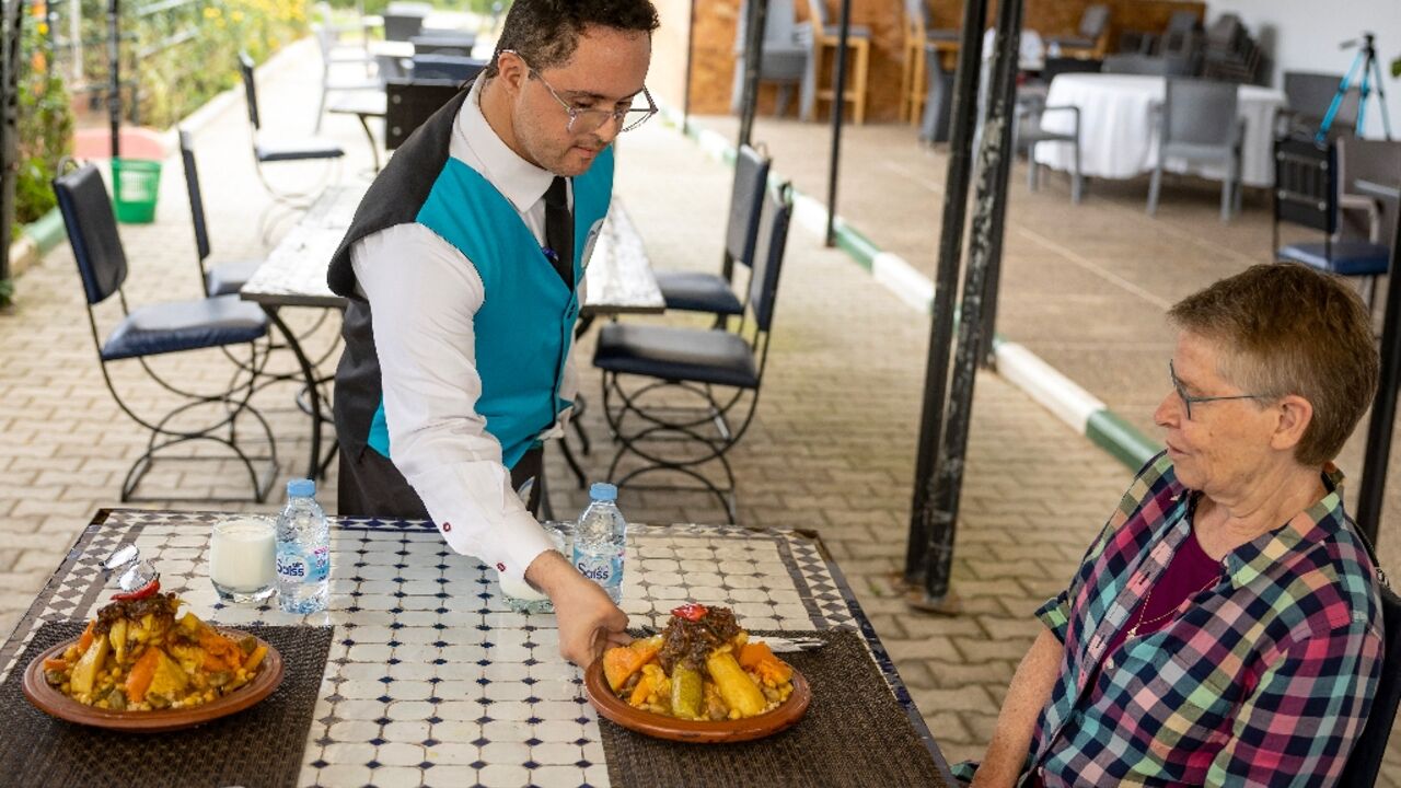While some of the workers in Sale cook and work the tables, others attend to the farm field where the restaurant's vegetables are grown
