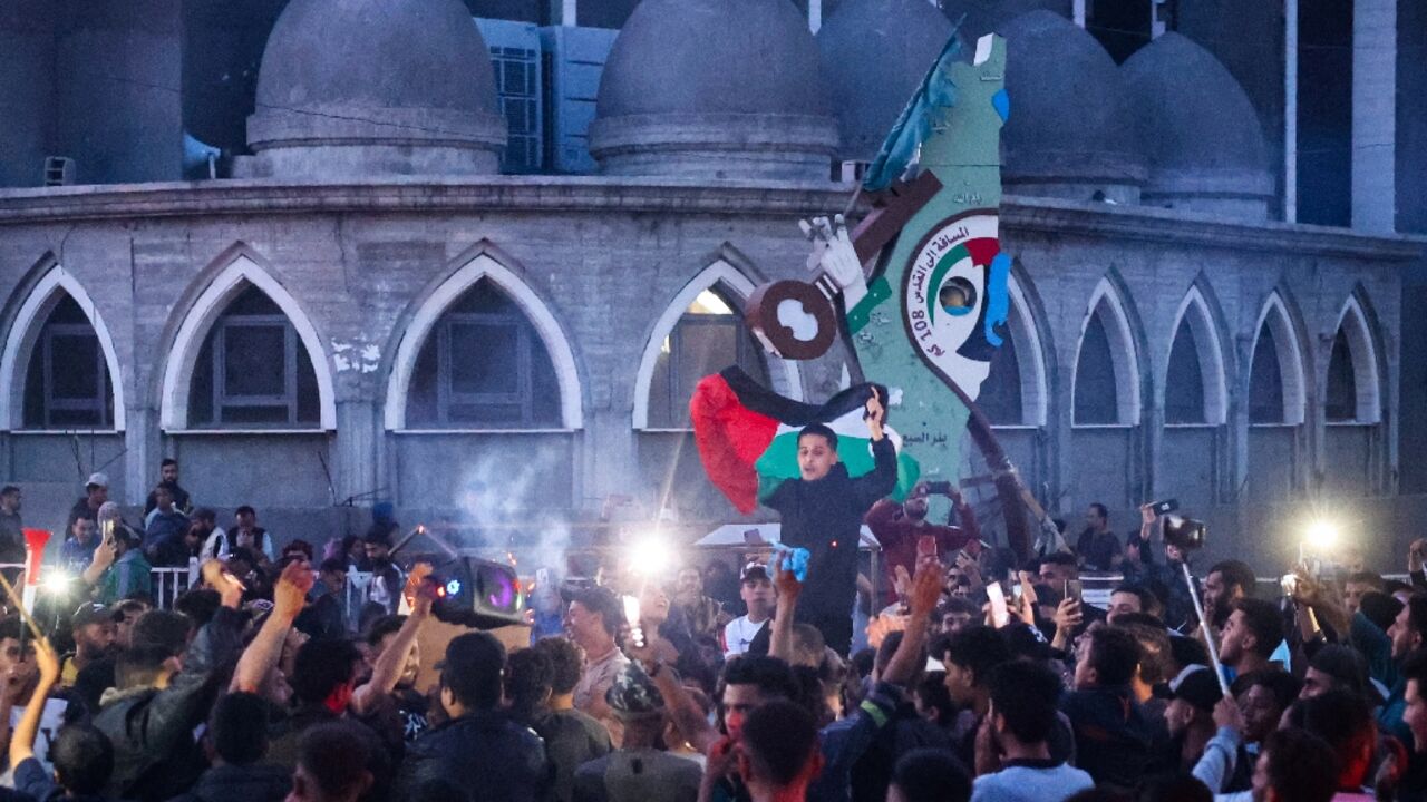 Gazans celebrated in the streets of Rafah after Hamas said it agreed to a truce proposal from Qatar and Egypt to pause the war with Israel