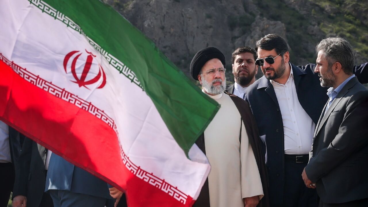 A picture provided by the Iranian presidency shows President Ebrahim Raisi at the site of Qiz Qalasi, the third dam jointly built by Iran and Azerbaijan on the Aras River