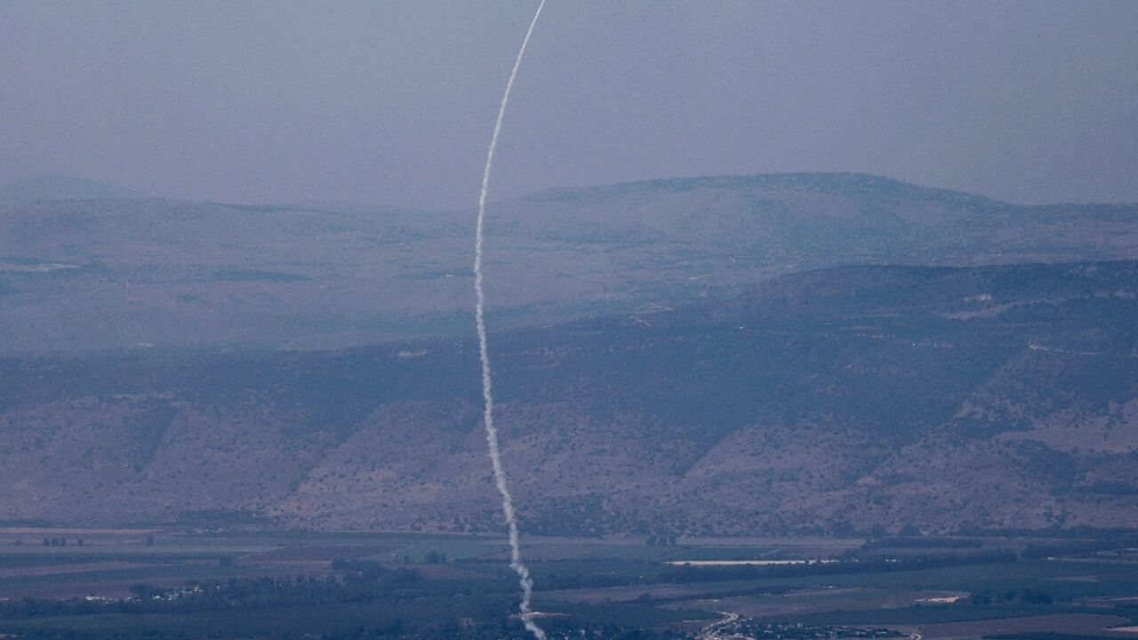 A rocket fired from southern Lebanon is intercepted by Israel's Iron Dome air defence system over northern Israel