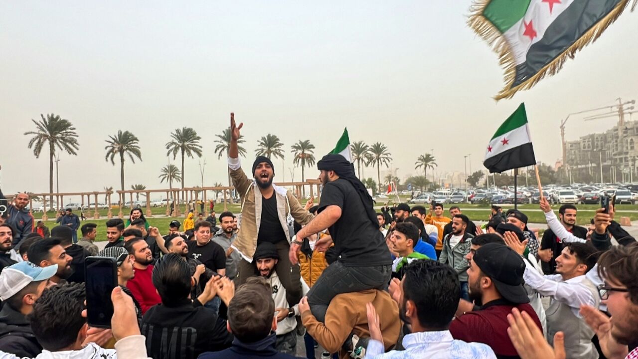 Members of the Syrian community in Libya celebrate the fall of Bashar al-Assad in Tripoli