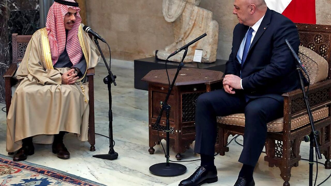 Lebanese President Joseph Aoun (R) speaks with visiting Saudi Arabian Foreign Minister Faisal bin Farhan on Thursday