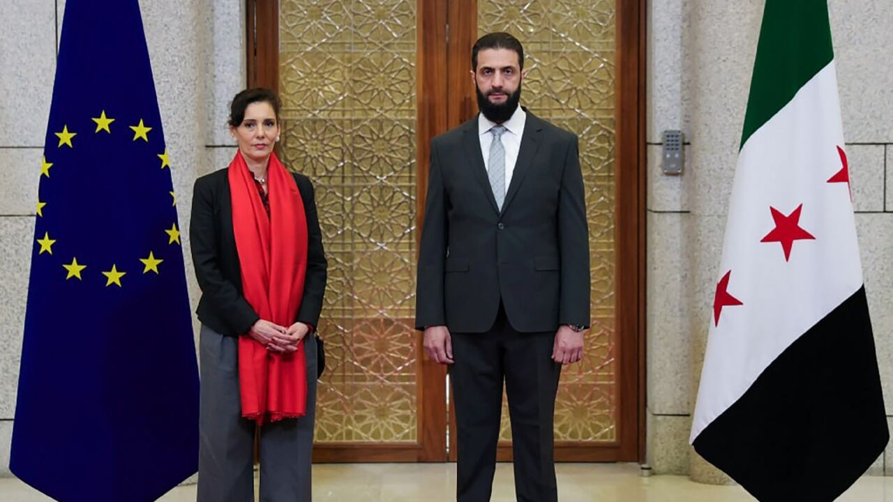 This handout picture released by the Syrian Arab News Agency (SANA) shows Syria's new leader Ahmed al-Sharaa meeting with EU crisis management chief Hadja Lahbib in Damascus