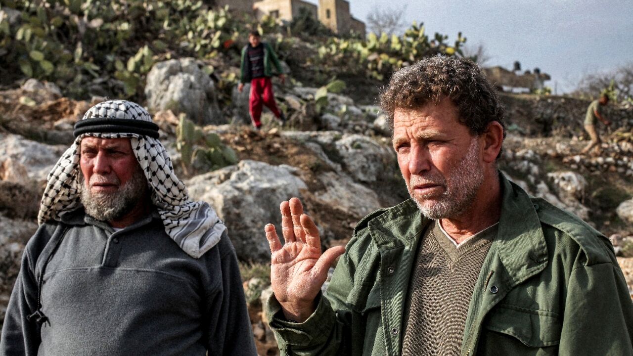 Palestinian prisoner Nael Barghouthi (R), seen here in 2013, is set to be deported after his release as part of a Gaza ceasefire deal