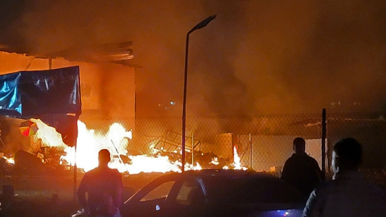 Rescuers rush to the site of an Israeli airstrike that targeted an area in the southern Lebanese village of Nabatiyeh al-Fawqa