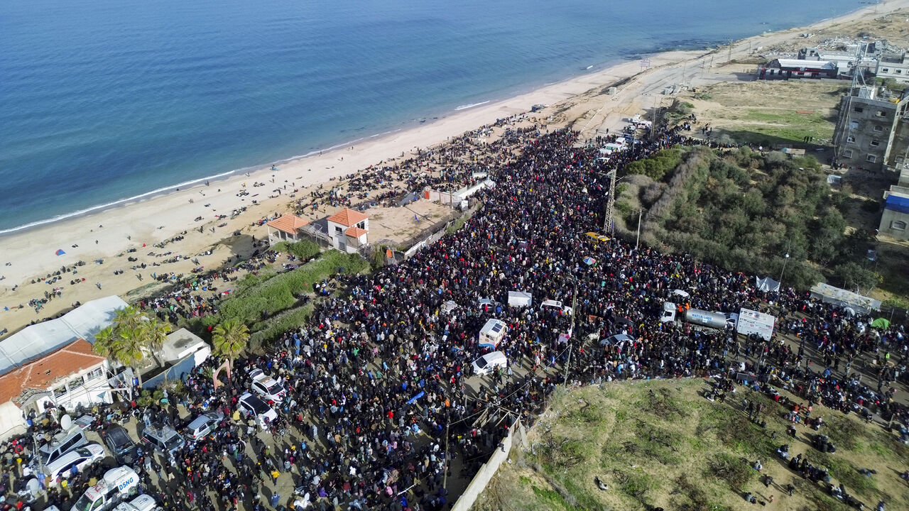 This aerial photo shows displaced Gazans gathering in an area in Nuseirat to return to their homes in the northern part of the Gaza Strip, Jan. 26, 2025.