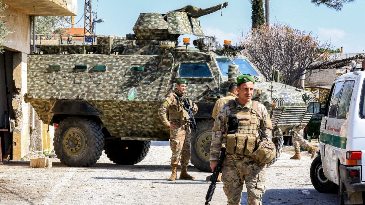 Lebanese army soldiers stand guard at the entrance of the southern Lebanese town of Hula
