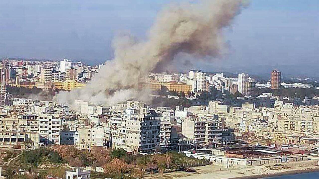 This picture released by Syrian state media shows smoke billowing over the coastal city of Latakia after a deadly explosion that a war monitor said was caused by unexploded ordnance.