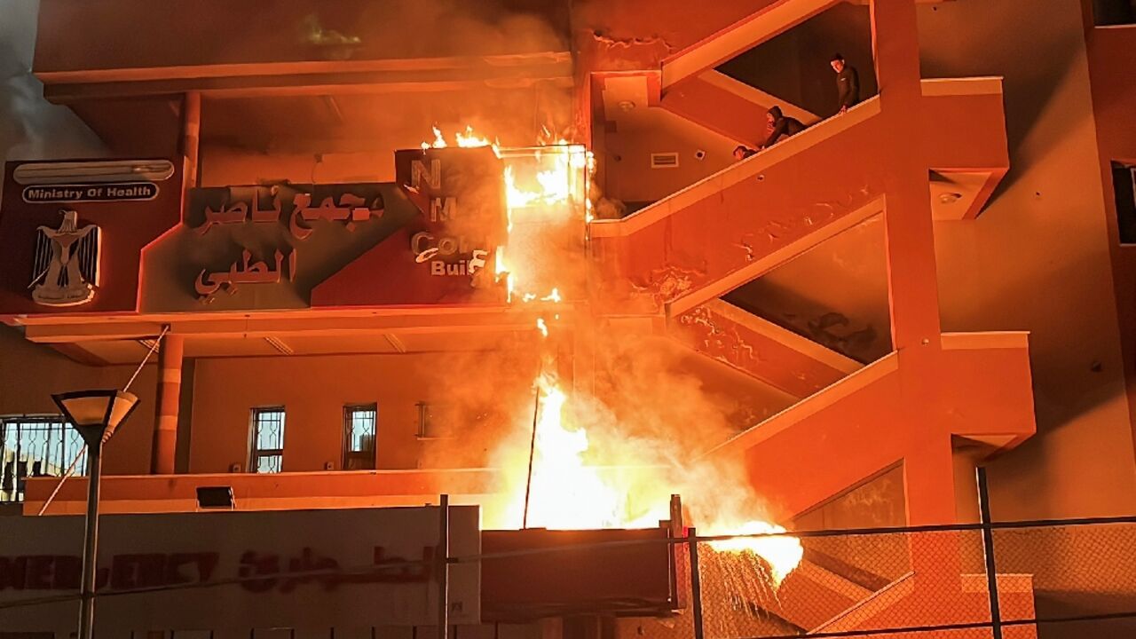 Fire burns at the emergency department of Nasser Hospital in Khan Yunis, southern Gaza, after an Israeli air strike